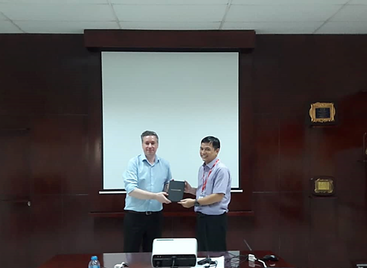 Professor John Hudson, Head of Department of Social Policy and Social Work, University of York, UK gave a souvenir for Mr. Lam Nguyen Hai Long, QTSC’s CEO